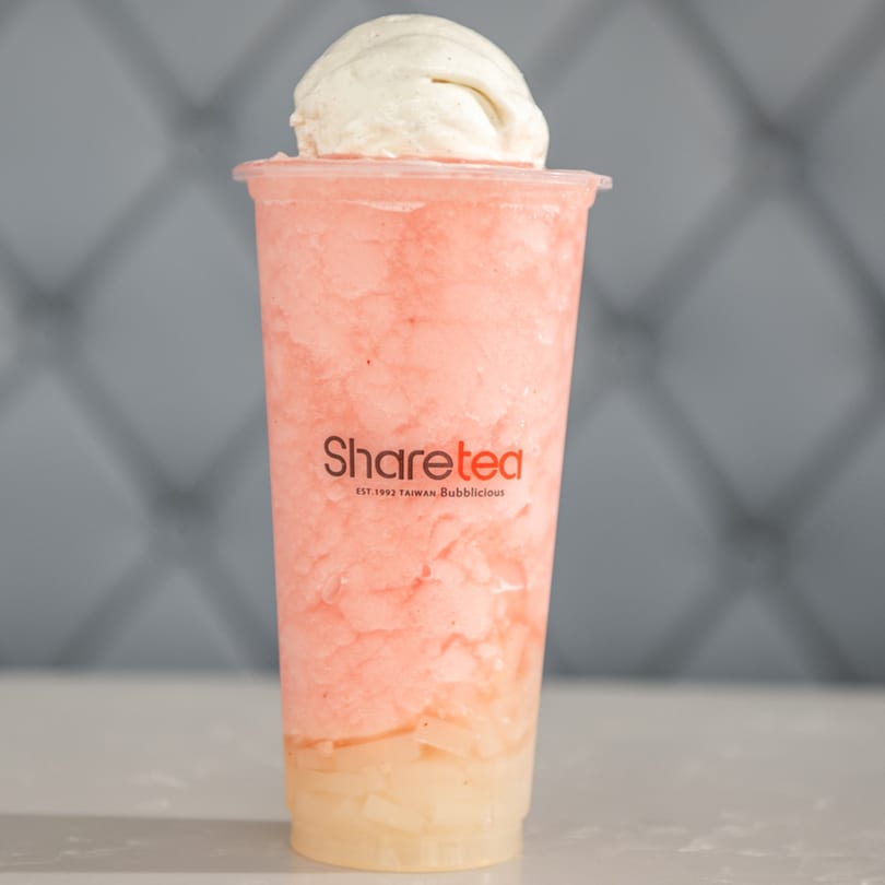 Sharetea's strawberry slush with a scoop of vanilla ice cream and fruit jelly on a counter.