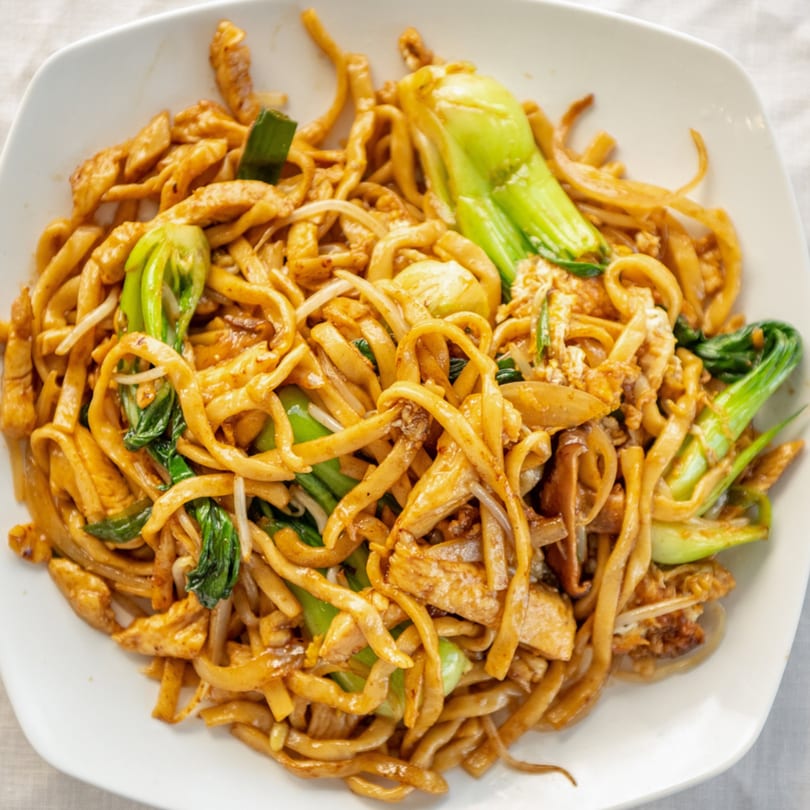 Close-up of Sharetea Fatty Panda's stir-fried noodles with chicken, bok choy, and bean sprouts.