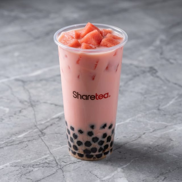 Watermelon Coco Green Milk Tea w/ Pearls.